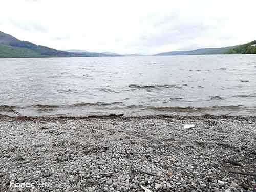 A beach overlooking a valley in the distance